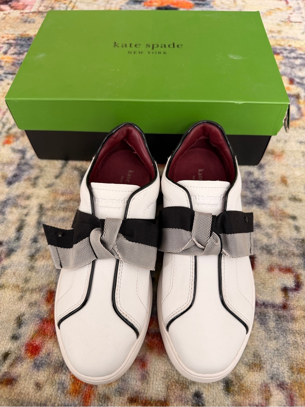 kate spade White Leather Slip-On Sneakers with Black & Gray Bow Trim